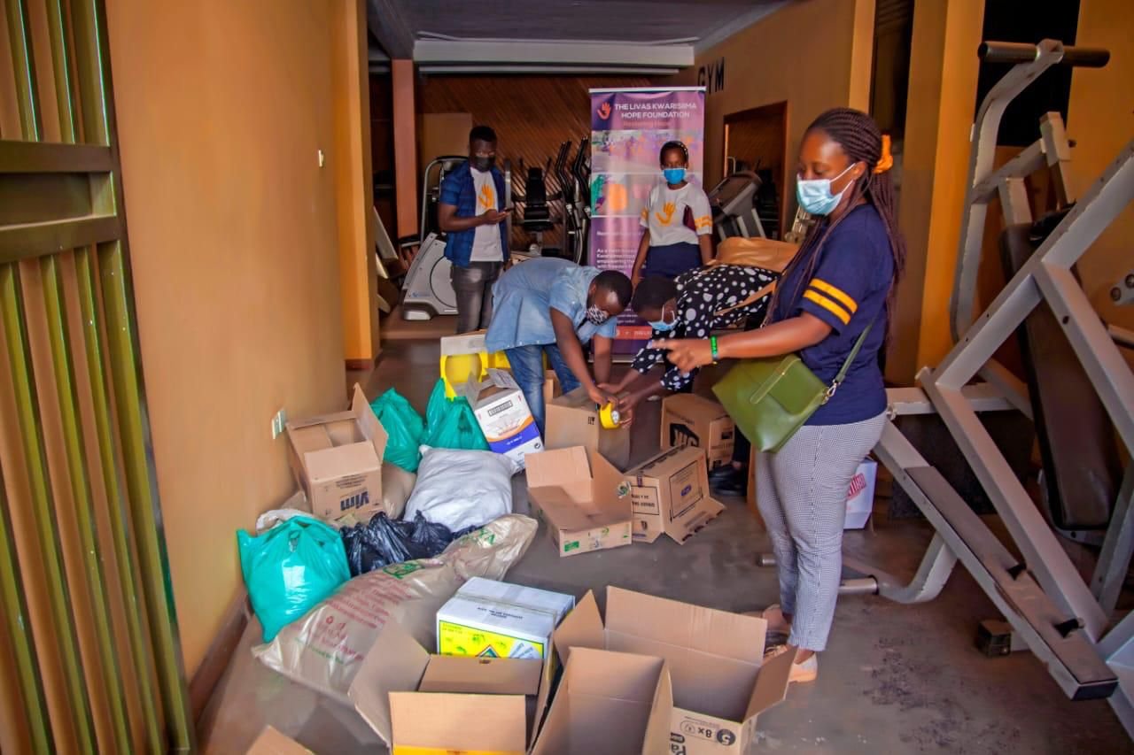 LKH members packaging food items into boxes, preparing them for distribution.